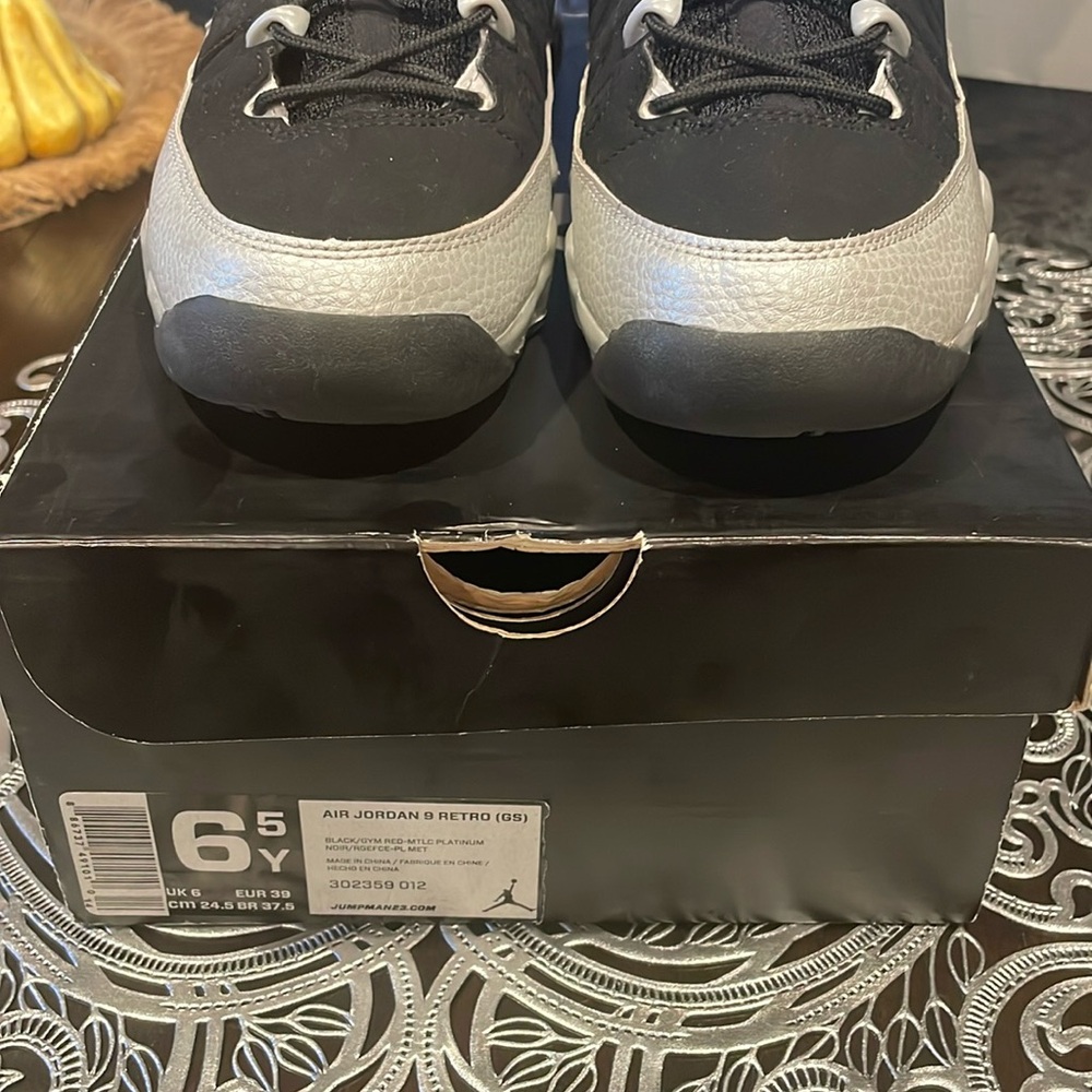 Air Jordan 9 RETRO (GS) size 6 1/2 color black & gray with red inside.